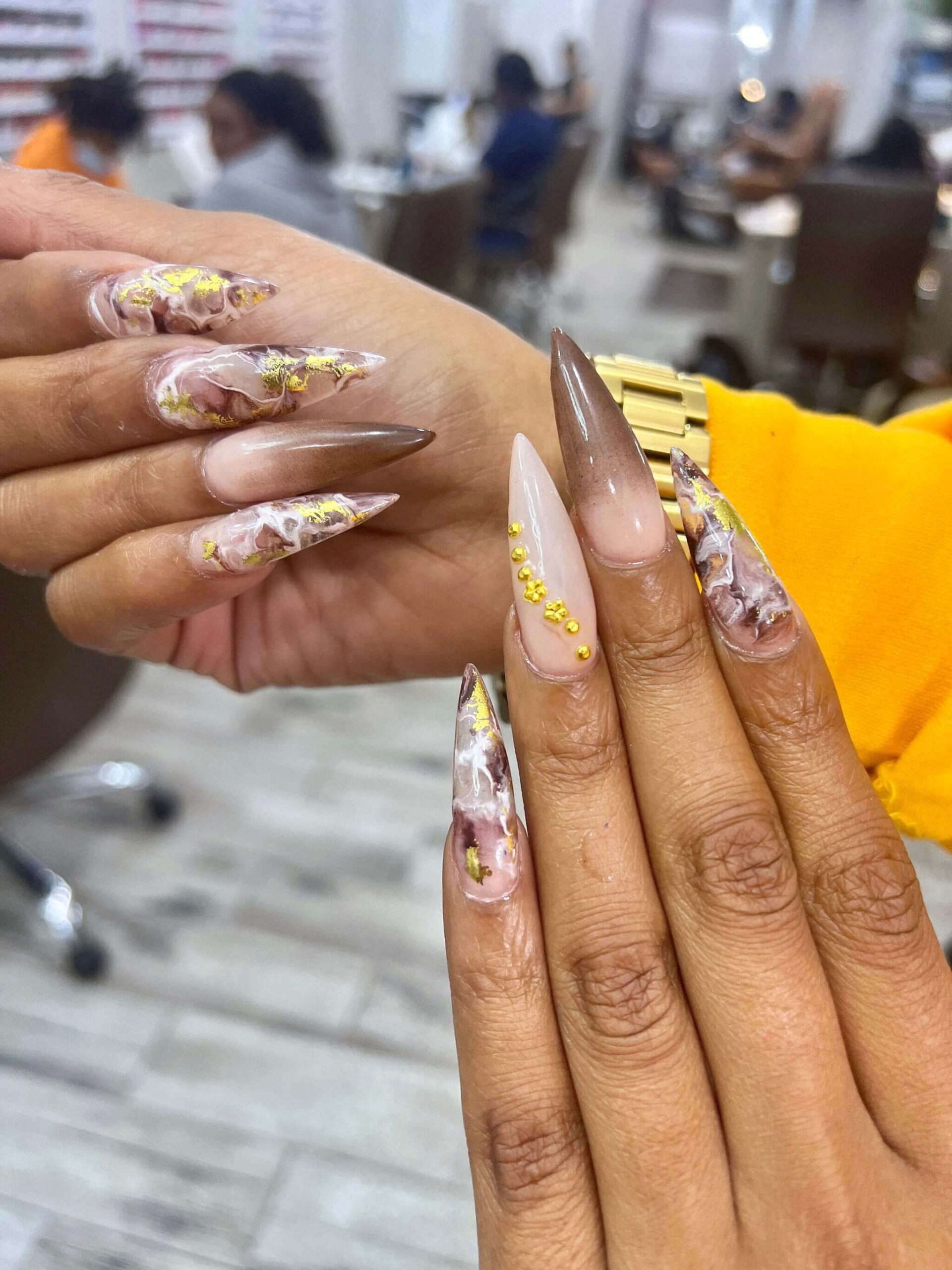 Long embellished nails with intricate nail art