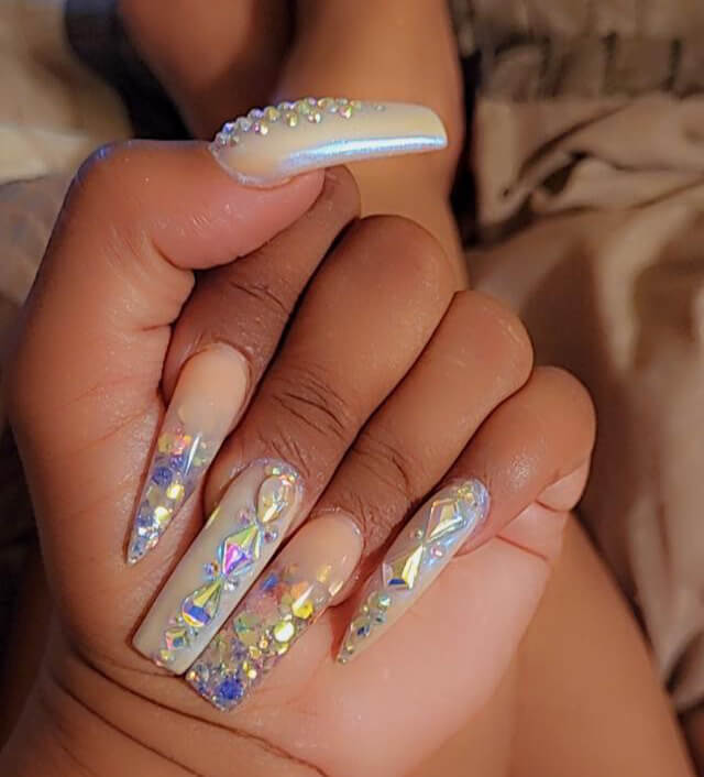 Glossy sculpted nails with jewel accents